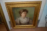 Head and shoulders portrait of a young lady, her hair tied up, wearing white frilled collar over a floral patterned dress by F. Norman, oil, sold Jan 2018