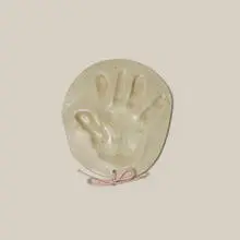 Untitled (Handprint) by Beatrice Wood, 1991, glazed stoneware, nylon string, sold Jul 2026