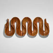 Movimento by Joaquim Tenreiro, c. 1950, rosewood, mahogany, sold Oct 2022
