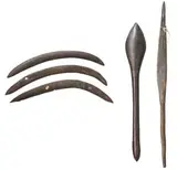 A Group Of Five Weapons by Artefacts And Carvings, comprising a spear thrower, bulbous-headed club and three Queensland boomerangs, all unadorned with old patina, offered Mar 2010