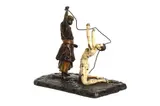 A cold painted bronze model of a slave trader and nude slave by Franz Bergman, bronze, offered Aug 2022