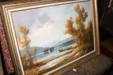 GERMAN, BOATS ON LAKE IN MOUNTAINOUS LANDSCAPE, with fishermen and women tending nets by Hans Wagner, oil on canvas, sold Jan 2017