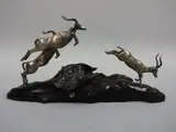 a silver sculpture modelled as three leaping impalas on naturalistic hardwood base, monogrammed PM, approximately 20.5cm x 10.5cm high by Patrick Mavros, sculpture, sold May 2016