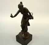 (Austrian Born 1867), bronze figural study of a maiden with basket of flowers, offering by R Kuchler, bronze, sold Mar 2016