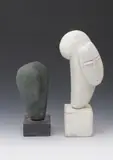 Cubist Head, a polished porcelain sculpture, on slate base and another taller painted white, incised signature 21.5cm by Peter Hayes, sculpture, sold Apr 2016