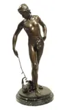 A late 19th century bronze figure of a young man playing with a cat, the base signed 'L.STEINER by Clement Leopold Steiner, bronze, offered Jan 2016