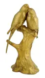 A gilt bronze model of two parakeets standing on a stump, the base signed 'G by Georges Gardet, bronze, sold Jan 2016