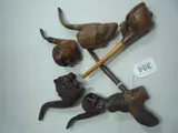 G Cooke & Co Oxford Brasenose, LTG lion mask, skull, long nosed and two other masks of men (6) by Six Novelty Carved Figural Wooden Pipes, sculpture, sold Jan 2016