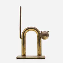 Cat bookend, model 17042 by Walter von Nessen, c. 1930, brass, sold Aug 2022