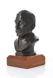 Portrait Bust by Coert Steynberg, bronze cast mounted on a wooden base, sold May 2026