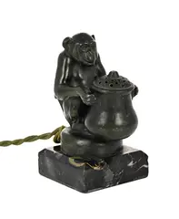 AKA 'Max Le Verrier by Max Le Verrier, bronze 'monkey with brazier' nightlight on a portoro marble base, sold May 2026