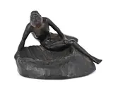 Nude lady gazing into a conch shell by Hilda Brag, bronze, sold May 2026