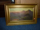 sun setting behind mountainous range, oil on board in gilt frame by J Ducker, oil on board, sold Nov 2015