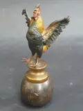 a cold painted bronze figure of a cockerel, modelled standing with wings by Franz Bergman, bronze, sold Mar 2015