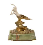 Reclining Nude on a rocky base, a gilt bronze and ivory model, on a green onyx base by Georges Omerth, bronze and ivory, offered Oct 2018