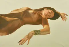 A recumbent female nude wearing a bracelet by Alan Brassington, oil on canvas, offered Apr 2022