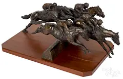 of four jockeys on horseback by Jean Clagett, bronze, offered Jan 2019