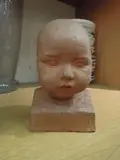 Tête d'enfant by Felix Desruelles, Terre cuite, sold Dec 2013
