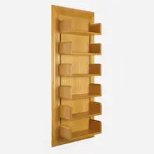 Custom wall-mounted shelving unit for the Friedman Residence, Greenwich by Warren Platner, 1989, oak, brass, sold Aug 2022