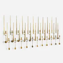 Lampett wall-mounted candleholders, set of twenty-three by Pierre Forsell, c. 1965, brass, sold Aug 2022