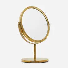 Table mirror by Hans Agne Jakobsson, c. 1955, brass, mirrored glass, sold Aug 2022