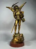 Saint Michel terrassant le dragon by Emmanuel Frémiet, Bronze à patine dorée signée sur socle en marbre rouge antique (égrenures) Hauteur totale, sold Jun 2024
