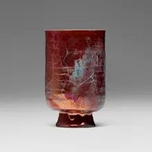 Tall footed vessel by Beatrice Wood, c. 1980, lustre-glazed earthenware, sold Jan 2026