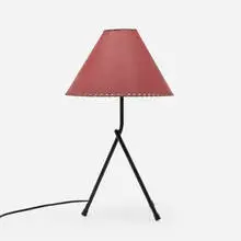 Table lamp by attribution Jacques Biny, c. 1955, enameled steel, paper shade, sold Aug 2022