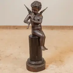 Untitled by Joseph Giuseppe D'Aste, bronze of a putto seated on a partial column playing a pipe, sold Mar 2026