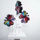 is a limited-edition resin by Romero Britto's Three Butterflies, enamel and wood sculpture, sold Apr 2025