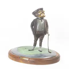 Golfer by Don Hedin, bronze sculpture with polychrome on wood base, sold Dec 2024
