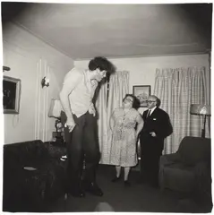 A Jewish giant at home with his parents in the Bronx, N.Y. by Diane Arbus, 1970, Gelatin silver print from A Box of Ten Photographs, printed 1973 by Neil Selkirk, sold Oct 2026