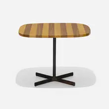 Occasional table by Allan Gould, c. 1955, walnut, birch, enameled steel, sold Aug 2022