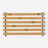 Wall-mounted coat rack by Carl Auböck, c. 1945, laminate over wood, brass, enameled steel, sold Jul 2022