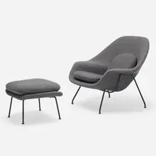 Womb chair and ottoman by Eero Saarinen, 1946 / 1960, enameled steel, upholstery, sold Jul 2022