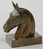 Tête de cheval by Max Le Verrier, Épreuve en bronze à patine brune nuancée signée sur la crinière, sold Jun 2010