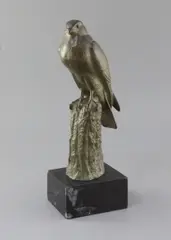 A green patinated bronze model of a falcon perched upon a tree stump by Irénée Rochard, bronze, sold Apr 2019