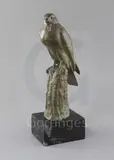 A green patinated bronze model of a falcon perched upon a tree stump by Irénée Rochard, bronze, sold Mar 2019