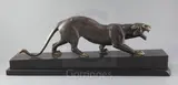 An Art Deco bronze model of a prowling panther, on black marble plinth, 28in by Irénée Rochard, bronze, sold Mar 2019