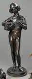 Le chanteur Florentin, modèle exposé en 1865 by Paul Dubois, Bronze à patine brun foncé nuancé, sold Mar 2011