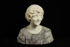 AN ALABASTER BUST OF A GIRL, the smiling young maiden wearing a headdress and a dress embroidered with flowers carved in coloured alabaster by Prof Giachi, sculpture, offered Mar 2021