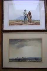 Single cottage on heathland, beneath stormy sky, watercolour, 37 x 52cm, together with another work by the same hand, An Elderly couple on open ground, a mountain beyond, watercolour,36 x 51cm (14 3/16 x 20 1/16in). by Frank Egginton, sold Mar 2012