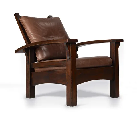A Rare Early Reverse-Tapered Bow-Arm Morris Chair, Model No. 336/2340 by Gustav Stickley, circa 1901, Quarter-sawn oak, sold Sep 2026