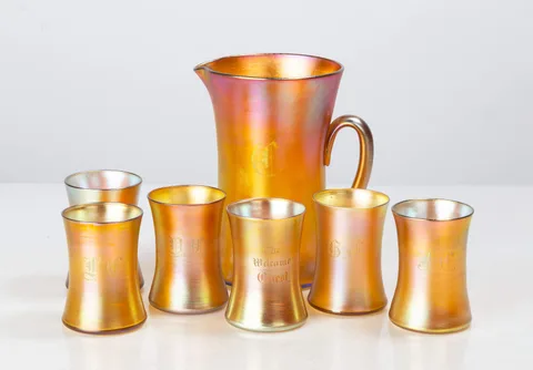 Favrile Pitcher & Glasses by Tiffany Studios, Blown and wheel-engraved Favrile glass, sold Sep 2026