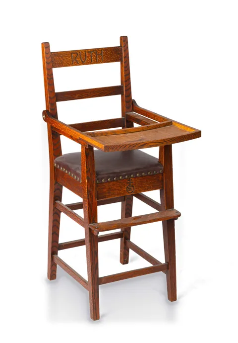 A Carved Oak Child's High Chair by Roycroft, circa 1915, Quarter-sawn oak, sold Sep 2026