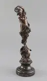 Standing upon a winged wheel and clouds by Paul Aichele, bronze, sold Jul 2018