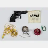 Bang You're Dead, Gun with Flag and Streamers, 1991, Plastic gun, paper streamers, satin flag and by Karen Kilimnik, oil paint installation, offered Sep 2016