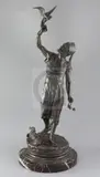 A 19th century French bronze figure of a falconer, in Middle Eastern costume holding his hand aloft, with a hare at his feet by Pierre-Jules Mêne, bronze, sold Mar 2018