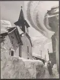 Dans la rue du village enneigé by Georges Tairraz Iii, vers 1950, Tirage argentique contrecollé sur carton, portant le cachet humide du photographe au dos, sold Dec 2021