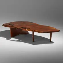 Slab coffee table by George Nakashima, 1968, American black walnut, rosewood, sold Jun 2022